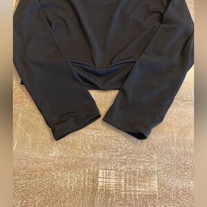 Dark grey coating and and 2 half tee tops. Excellent condition!  Size M